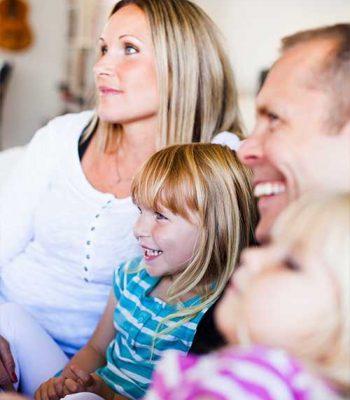 Artist decorating the boy's room with blue paint. Home during renovation, decoration and painting. Interior apartment improvement maintenance. Roller, ladder for house repair